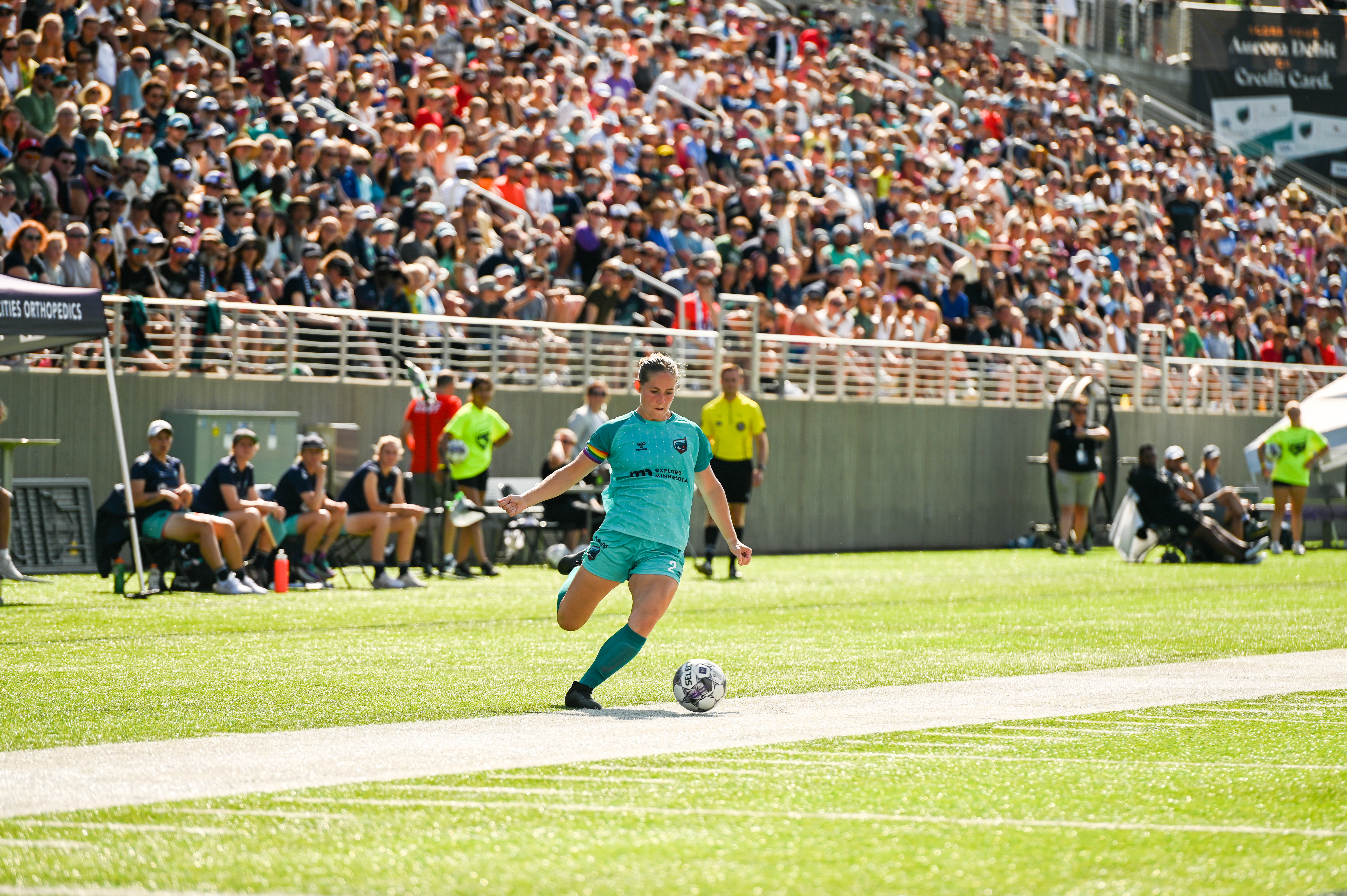 Aurora co-captain Makenzie Langdok sends in a cross in front of a sell-out crowd.